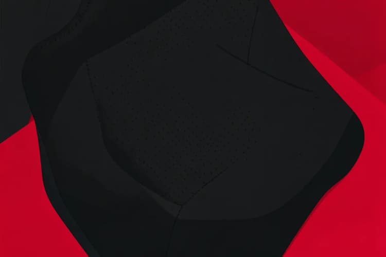 Detalhe de uma capa de banco de carro de neoprene preta com textura em relevo.