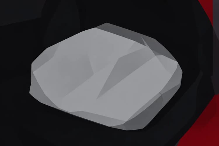 Close-up de uma capa de banco de carro de tecido cinza dobrada sobre um banco de carro preto.